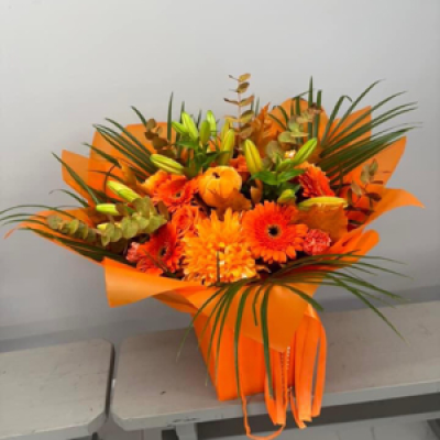 Orange Bouquet - Orange lillies, roses, blooms, gerberas and carnations gift wrapped in a bag of water