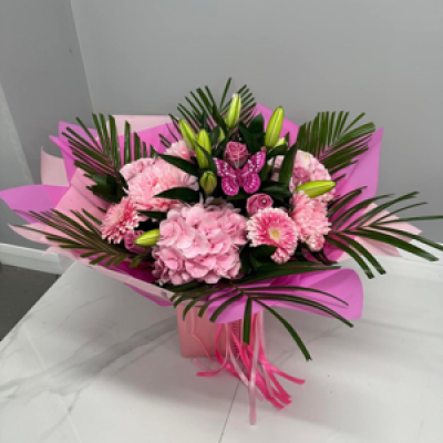 Pink Bouquet - Pink lily, roses, hydrangea, gerbera, bloom and carnations gift wrapped in a bag of water