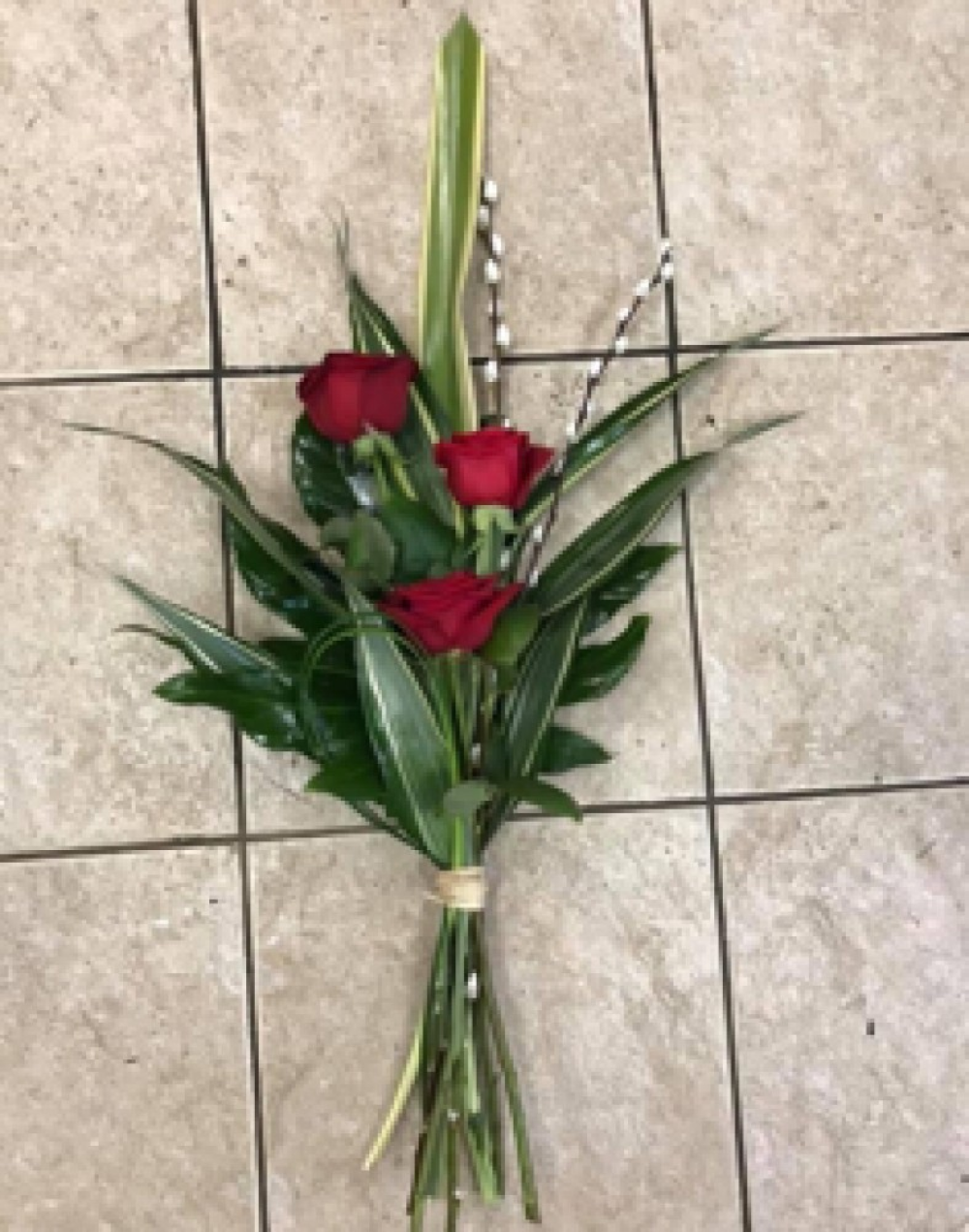 Red rose tied sheaf